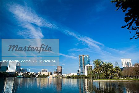 Reflection of buildings in water, Lake Eola, Orlando, Florida, USA