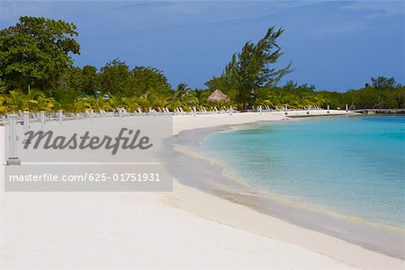 Lounge chairs on the beach, Coral Cay, Dixon Cove, Roatan, Bay Islands, Honduras