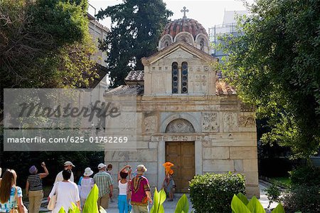 Tourists in front of a church, Panagia Gorgoepikoos, Athens, Greece