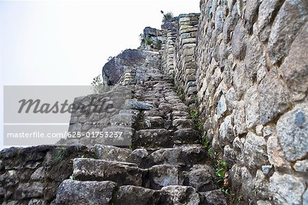 Low angle view of ruined steps, Aguas Calientes, Mt Huayna Picchu Machu Picchu, Cusco Region, Peru