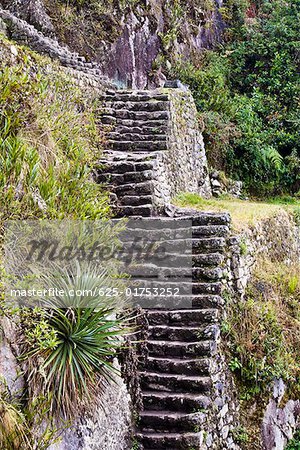 High angle view of ruined steps, Aguas Calientes, Mt Huayna Picchu Machu Picchu, Cusco Region, Peru