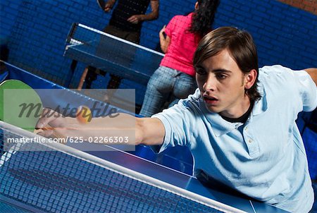 Young man playing table tennis