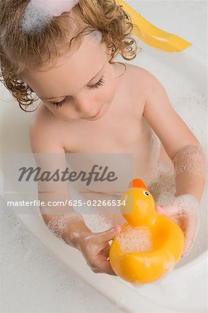 Close-up of a girl sitting in a bathtub