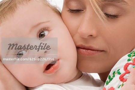 Close-up of a mid adult woman loving her son