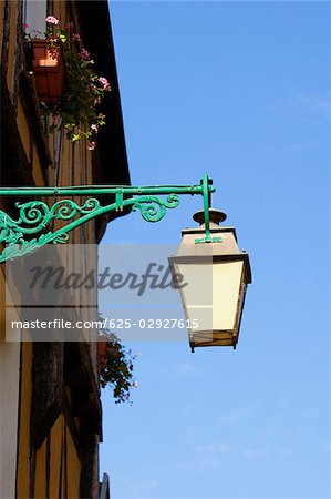 Low angle view of a lantern mounted on the wall, Le Mans, Sarthe, Pays-de-la-Loire, France