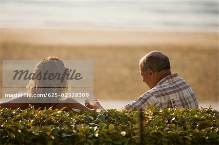 Rear view of a couple, Grande Plage, Biarritz, France