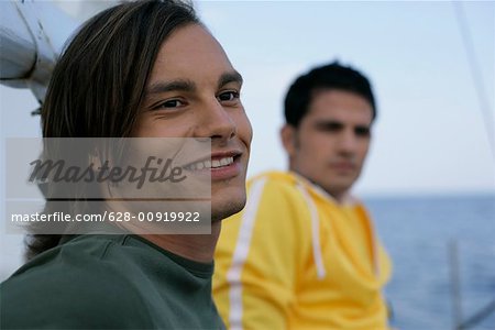 Two men on a sailboat