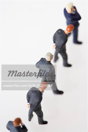 Businessmen figurines standing in a row