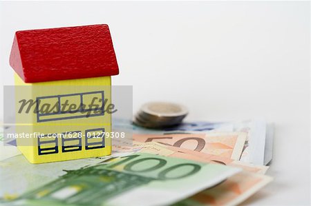 Toy house on Euro banknotes
