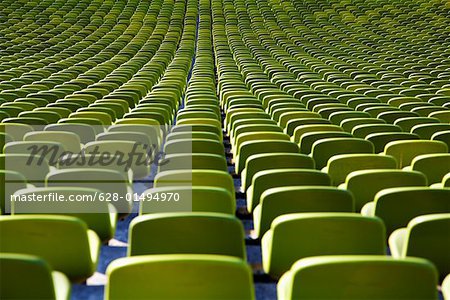 Seats in a row inside an empty stadium