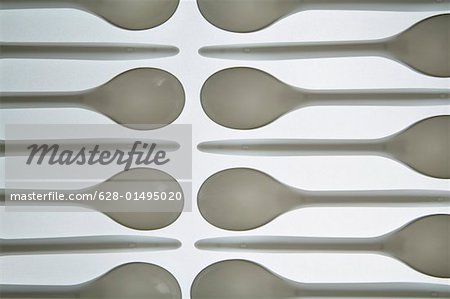 Plastic spoons in a row