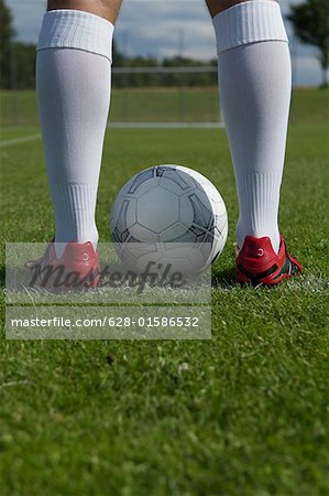 Ball between kicker's feet