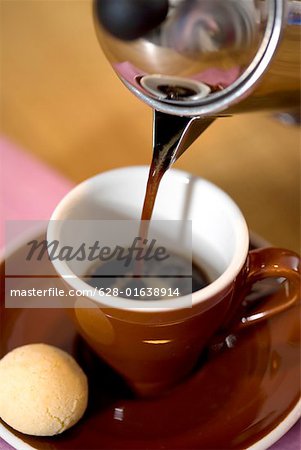 Coffee pouring in a cup
