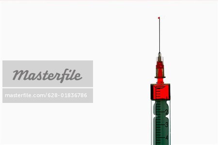 Syringe with red liquid