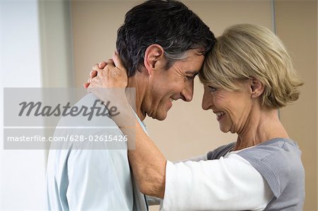 Couple head to head while smiling each other