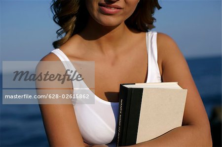 Woman holding a book in her hand