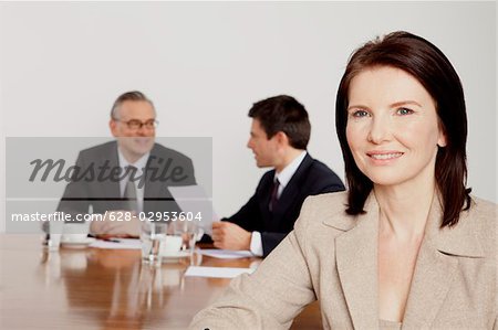 Three businesspeople in conference room, Bavaria, Germany