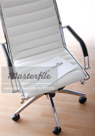 Paper On Office Chair With German Word For Job Vacancy Stock Photo Masterfile Premium Royalty Free Code 628 02953932