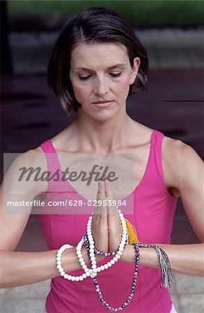 Woman with Praying-Pearls around her Hands - Buddhism - Posture - Meditation