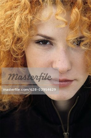 Portrait of a young Woman with strawberry-blonde Curls - Hair