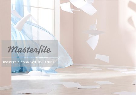 Papers are blown through room Papers are blown through room