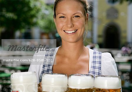 Waitress with four steins