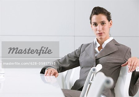 Businesswoman sitting in conference room