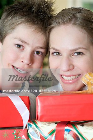 Happy brother and sister with Christmas presents, Munich, Bavaria, Germany