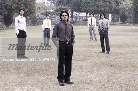 Portrait of five businessmen posing