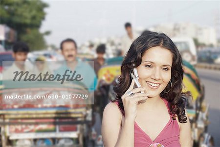 Close-up of a young woman talking on a mobile phone