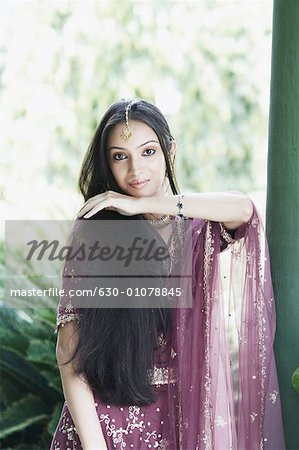 Portrait of a teenage girl posing in a traditional dress