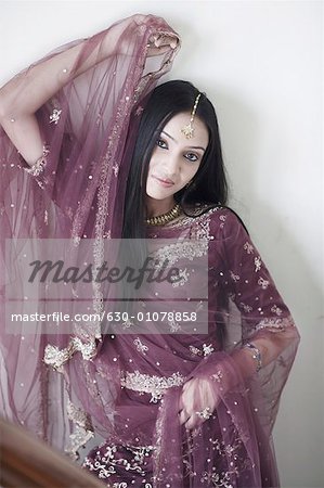 a woman in traditional indian attire poses for a photo. AI-Generated  32145125 Stock Photo at Vecteezy