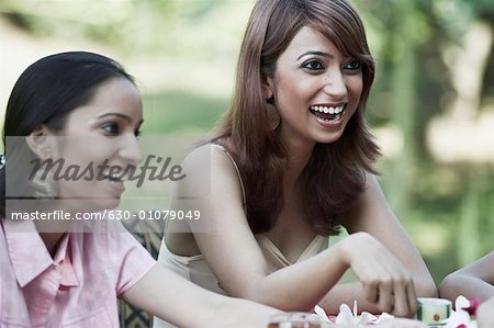 Close-up of a young woman and a teenage girl laughing