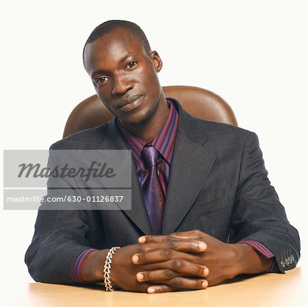 Portrait of a businessman with his hands clasped