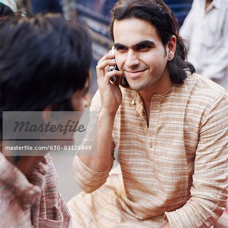 High angle view of a young man talking on a mobile phone
