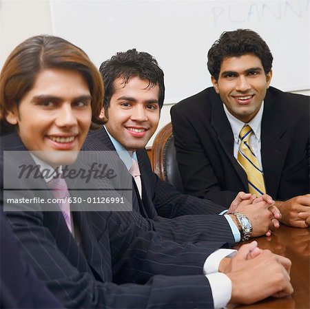 Portrait of three businessmen smiling