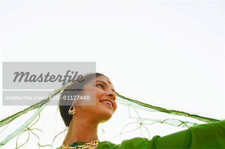 Low angle view of a young woman smiling