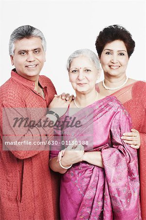 Portrait of a mature woman standing with a mature couple