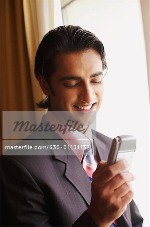 Close-up of a businessman using a mobile phone