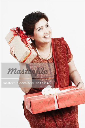 Close-up of a mature woman holding gifts