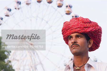 Low angle view of a young man looking away