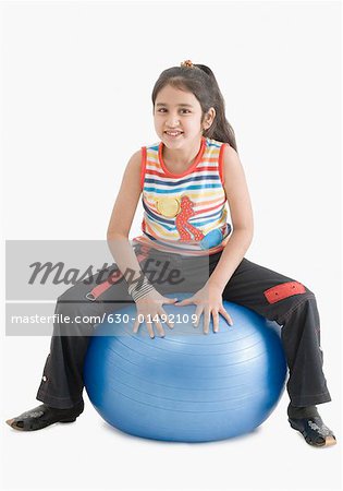 sitting on fitness ball