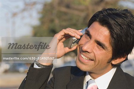 Close-up of a businessman talking on a mobile phone