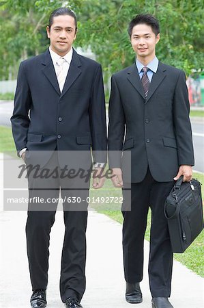 Portrait of two businessmen walking together