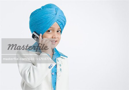 Portrait of a boy talking on a mobile phone