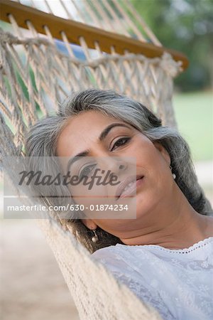 Portrait of a mature woman lying in a hammock