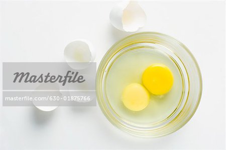 Close-up of egg yolks in a glass bowl