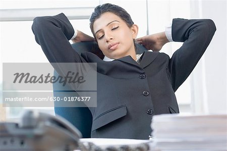 Close-up of a businesswoman sleeping in an office