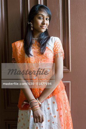 Portrait of a teenage girl smiling - Stock Photo - Masterfile