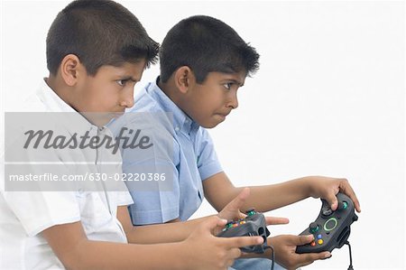 Children playing video game - Stock Photo - Masterfile - Premium